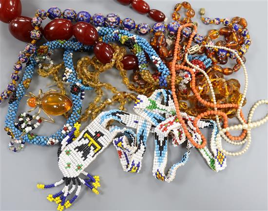 A group of assorted necklaces including simulated amber, coral, American Indian? bead and amber.